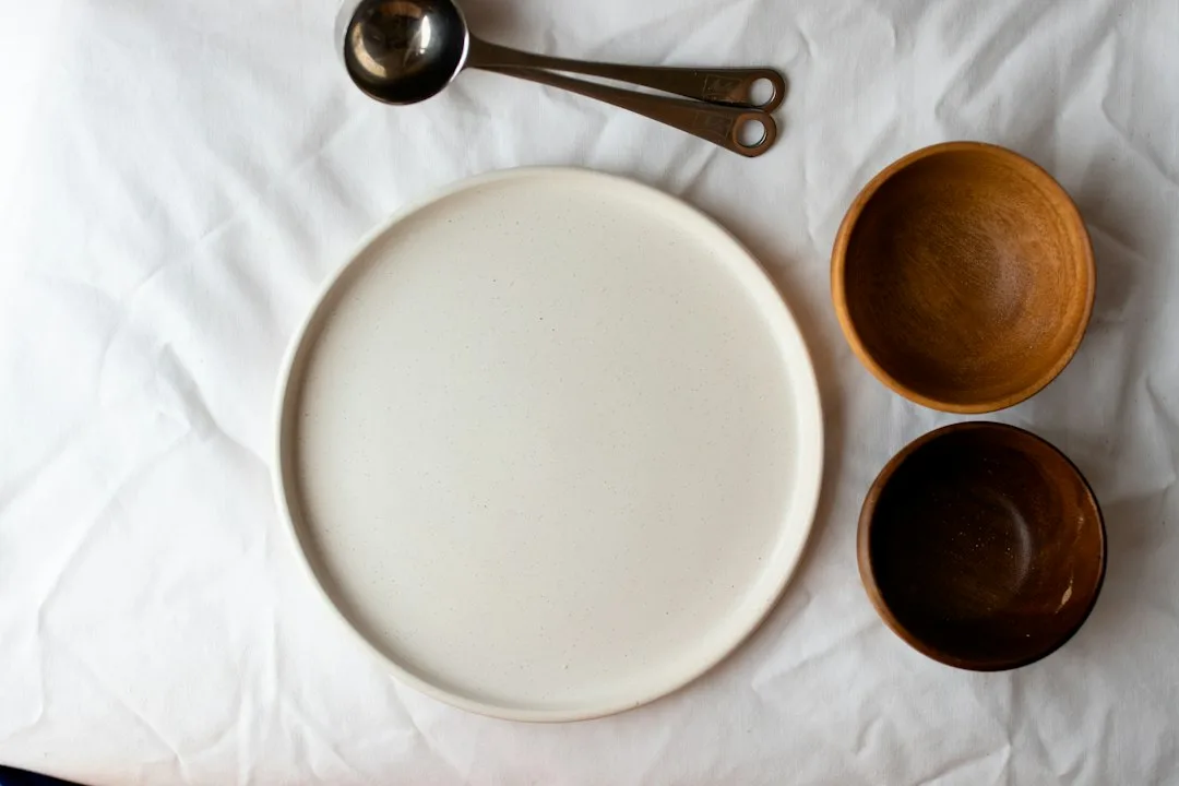 A large hand-built serving plate glazed in deep indigo